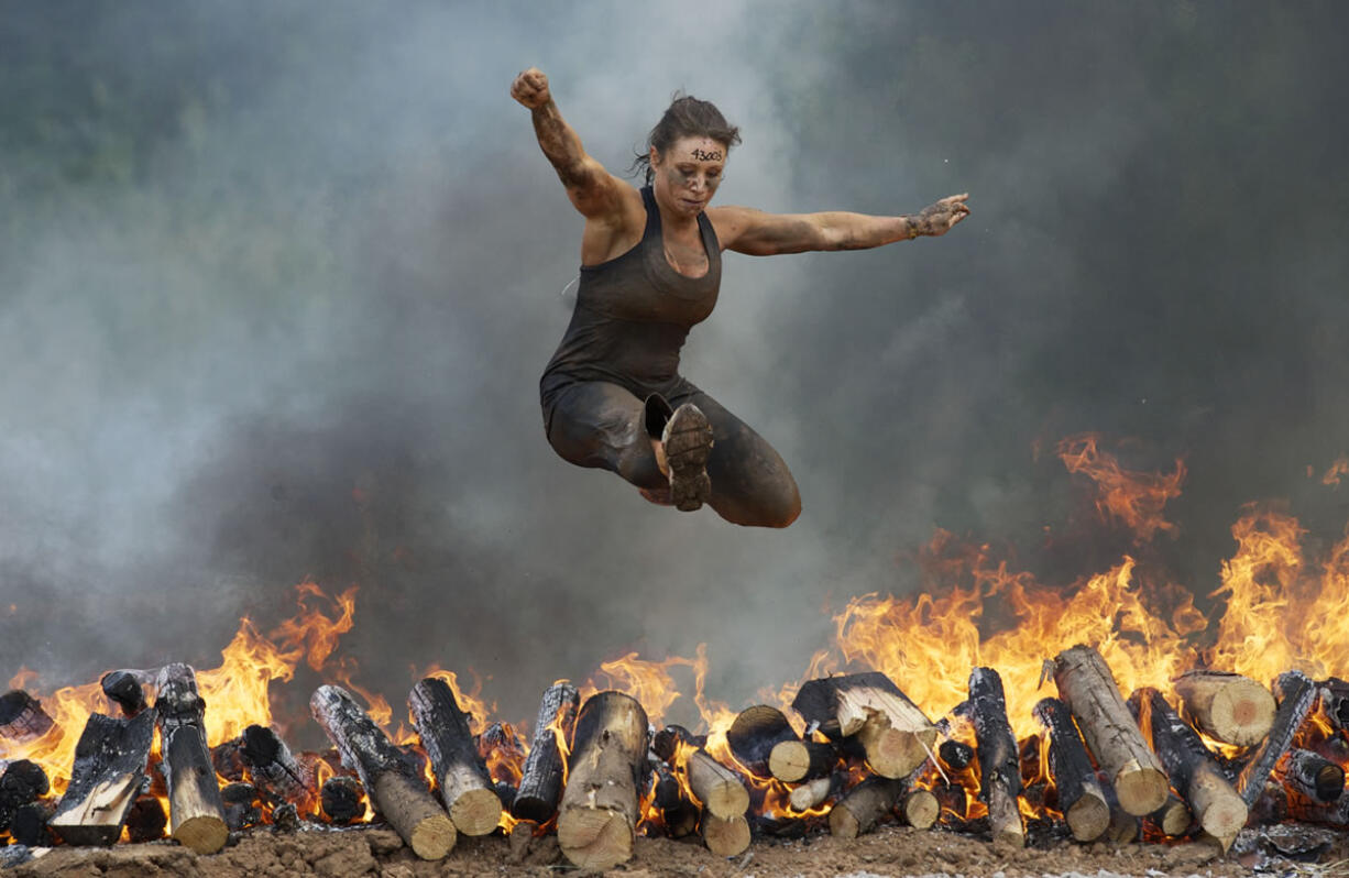 More than five thousand participants compete in the Spartan Race, a four-mile long extreme obstacle course, held at the Washougal MX Park, Saturday, June 16, 2012.