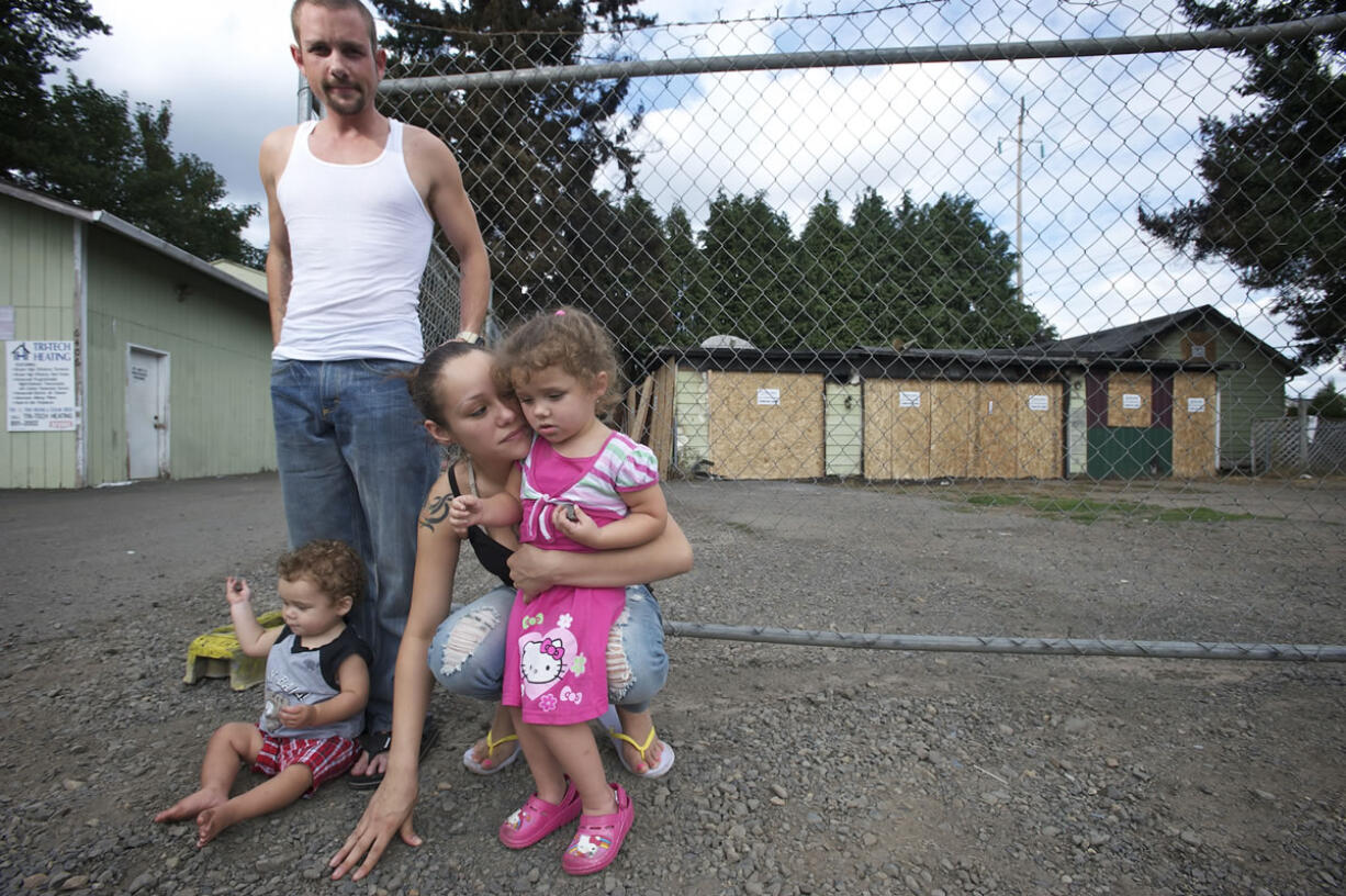 Scott Frauen, Jolanda Kolahi and their children Roxann, 3, and Cyrus, 1, were displaced Wednesday when a fire broke out in the garage of their duplex, destroying their home.