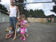 Scott Frauen, Jolanda Kolahi and their children Roxann, 3, and Cyrus, 1, were displaced Wednesday when a fire broke out in the garage of their duplex, destroying their home.