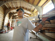 Tony Davis, in the Vancouver Lake Crew boathouse, said that his introduction to rowing was like being on a helicopter again.