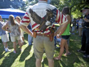 Vancouver resident Tracy Wilson, 53, joins others at a picnic Saturday at Esther Short Park organized by OpenCarry.org Washington.