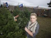 Kaitlyn Metscher, 16, operates a Christmas tree lot to help her save money for college.