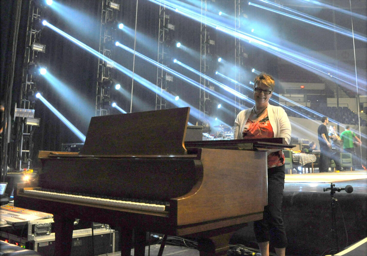 Hazel Dell: Pianist Melinda Dishaw absorbs some pre-show glow while getting ready to open for the Dalai Lama at Portland's Memorial Coliseum on May 11.