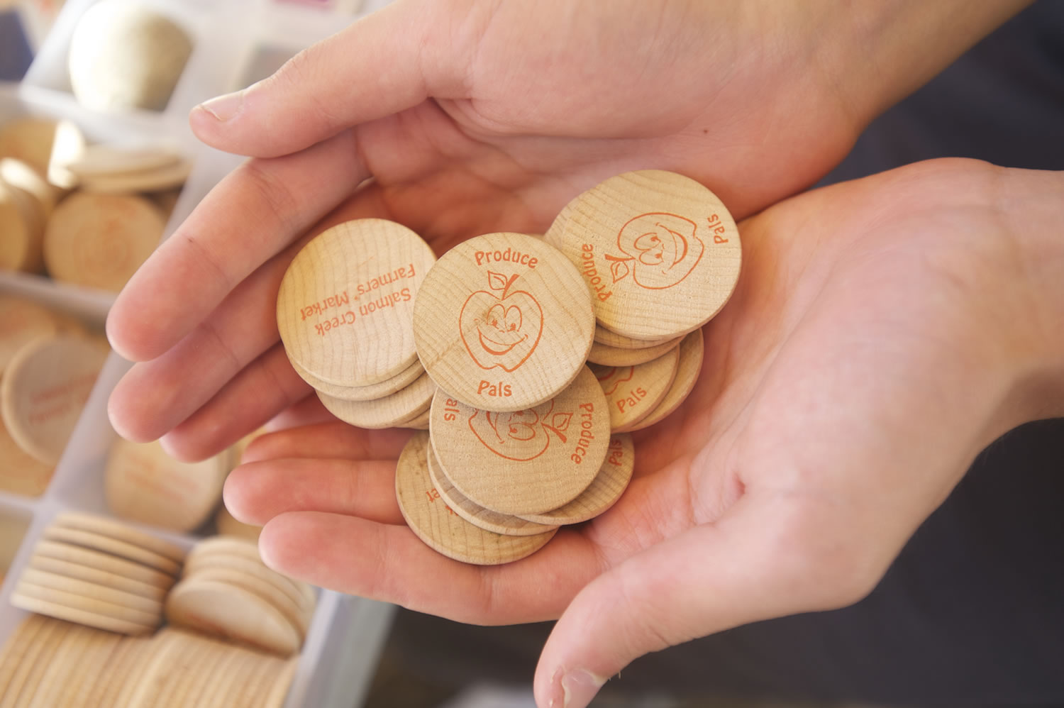 A new program at the Salmon Creek Farmers' Market gives Clark County kids tokens worth $2 to purchase fresh fruits and vegetables from vendors.