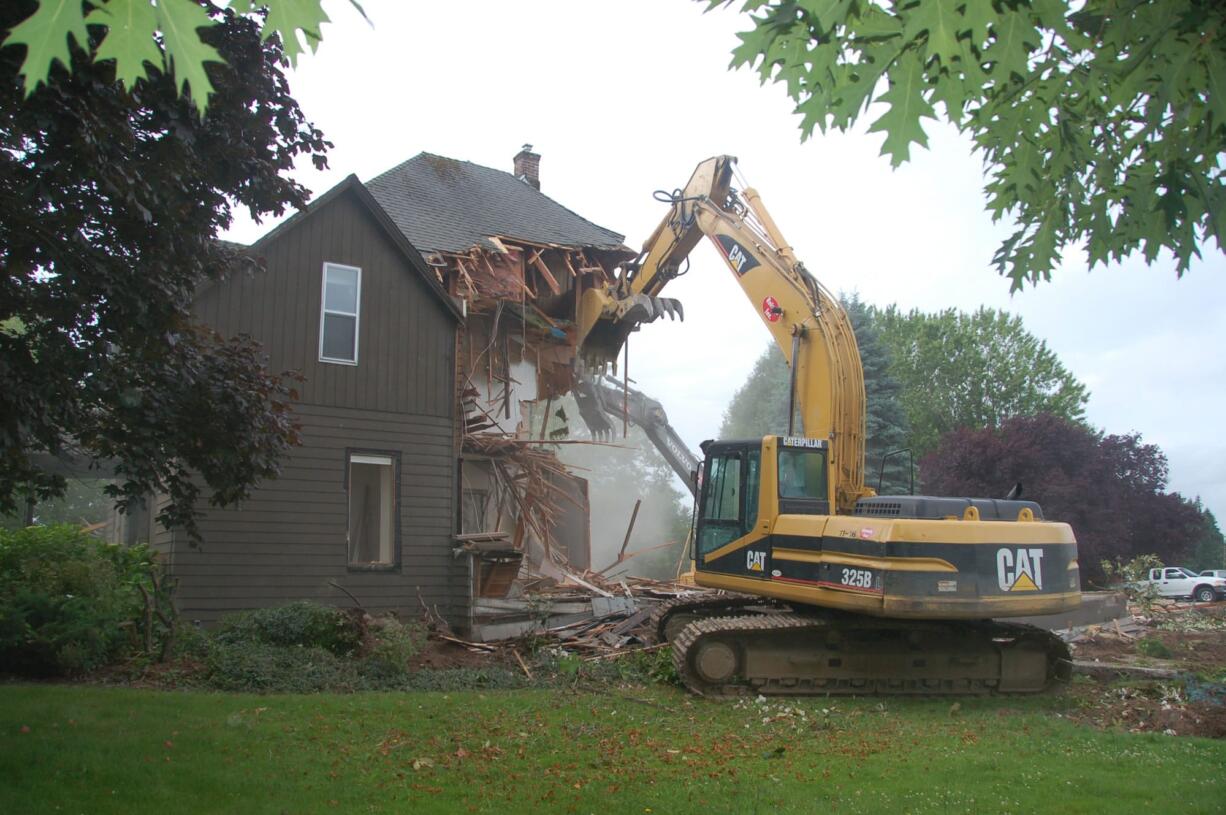 The old Erickson farmhouse is demolished.