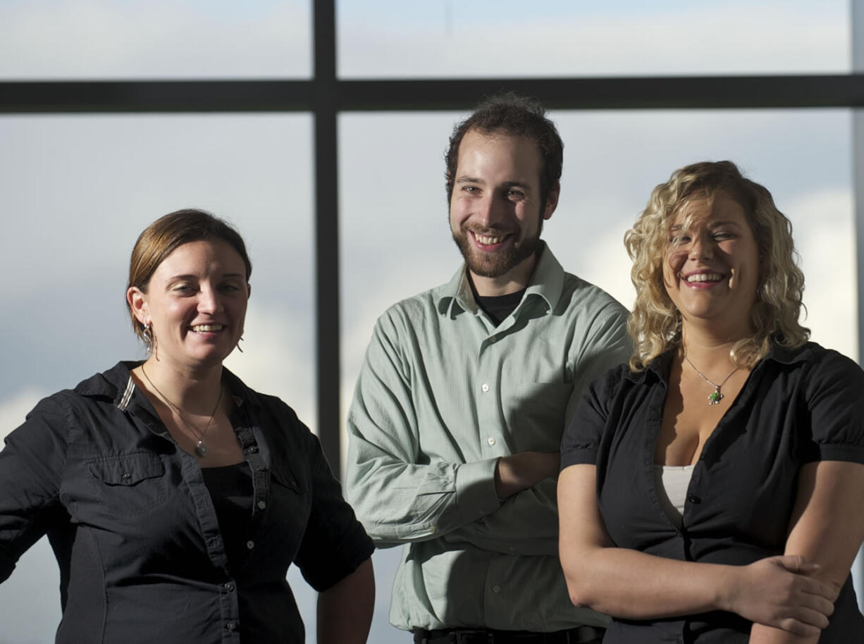 Washington State Opportunity Scholarship recipients, from left, Tracy Larson, Benjamin Griffith and Natasha Trachsel learned Wednesday that their annual award will increase fivefold, from $1,000 to $5,000, next fall.