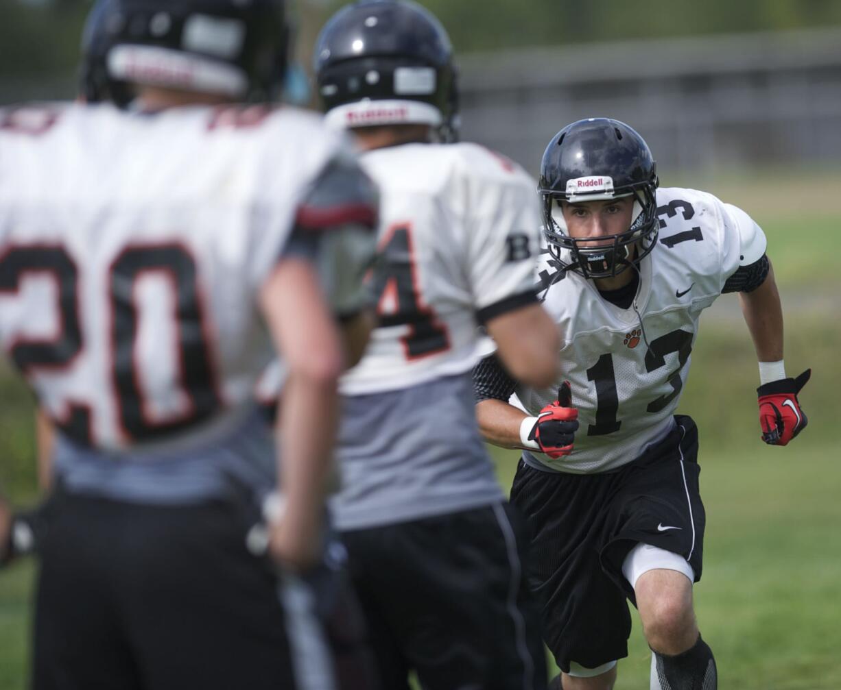 Battle Ground's Kaiden Grotte practices with the team on Tuesday August 21, 2012.