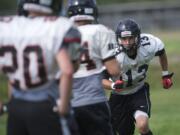 Battle Ground's Kaiden Grotte practices with the team on Tuesday August 21, 2012.