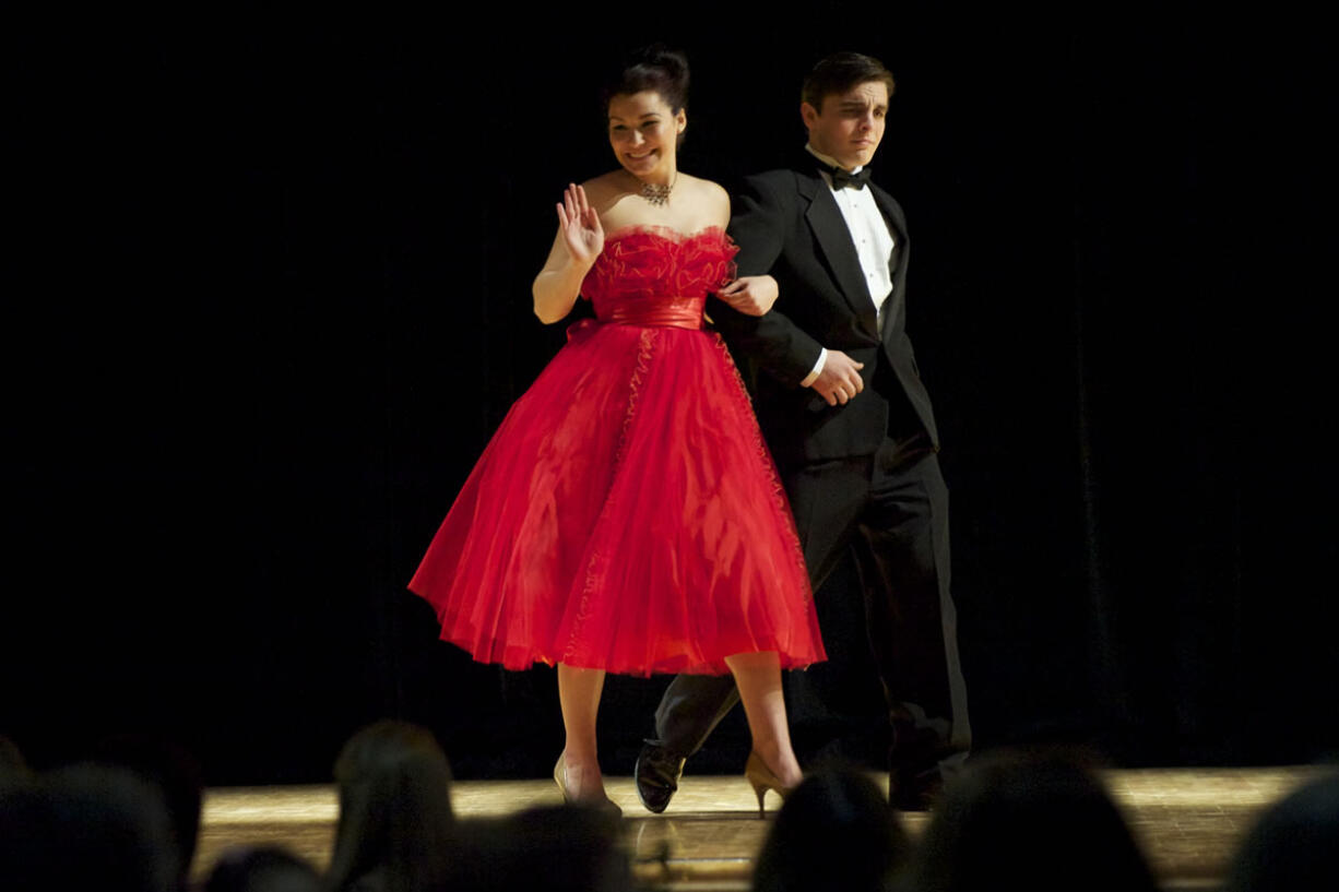 Claire Manning, 17, and Ian McDaniel, 18, rock their prom outfits during a Sunday tea and fashion show at Thomas Jefferson Middle School.