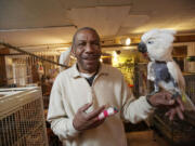 Chris Driggins with Einstein, an umbrella cockatoo who tore a fingernail off his right hand and sent &quot;Birdman&quot; to the emergency department.