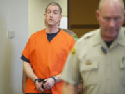 Mitchell O'Brien is escorted into Clark County Superior Court Judge John Nichols' courtroom to be sentenced for the June 2011 murder of Deneace L. McSpadden of Vancouver.