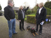 Evergreen Highway neighbors Chris Kellogg, from left, Jean Cox and Dode Jackson talk about safety concerns in their neighborhood.