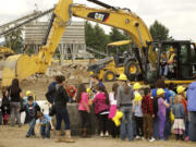 Students from Mill Plain Elementary, including the kindergarten students from Crestline Elementary, converged at the Cemex/Fisher Quarry for hands-on heavy equipment fun at the sneak preview of Dozer Day on Friday.