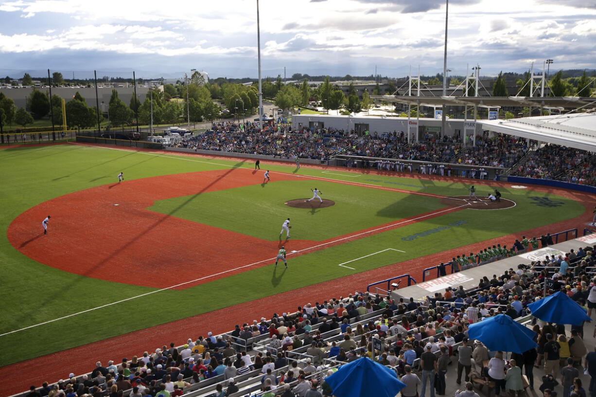 Jose Martinez of the Hillsboro Hops throws the first pitch against the Eugene Emeralds on Monday night at the new Hillsboro Ballpark.