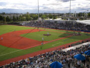 Jose Martinez of the Hillsboro Hops throws the first pitch against the Eugene Emeralds on Monday night at the new Hillsboro Ballpark.