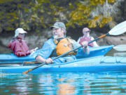 Bob Appling keeps track of members of the group as they paddle out of Cresap Bay on Lake Merwin.