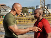 TNT
Darnell McAdams, right, learns about heroics from Dwayne &quot;The Rock&quot; Johnson on the new TNT competition series &quot;The Hero.&quot; Giving a hint about what's to come when the show premieres Thursday, Johnson sent the photo of the 32-year-old father to nearly 4.8 million Twitter users with the message: &quot;Family means everything to this man. Real men may cry ... they also overcome.&quot;