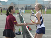 Skyview tennis player Sammie Hampton, right, plays a match against Prairie's Akari Baba, Wednesday, March 13, 2013.  Hampton won 6-0, 6-0.