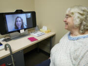 Olga Veter-Eluska of Vancouver, right, consults certified diabetes educator Juleeanna Andreoni in a telehealth visit -- avoiding the stress and risk of a drive to Portland.