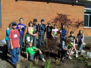 La Center: Youths in the La Center Lions' Leading LEO Club help plant a garden Oct.