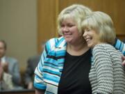 Clark County Superior Court Judge Barbara Johnson,right, hugs Vancouver attorney Suzan L. Clark on May 6 after Gov. Jay Inslee appointed Clark as the next Superior Court judge.