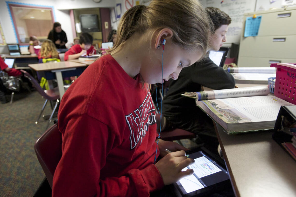 McLoughlin Middle School student Katie Johnson uses an iPad in Monica Hughey's sixth grade class.