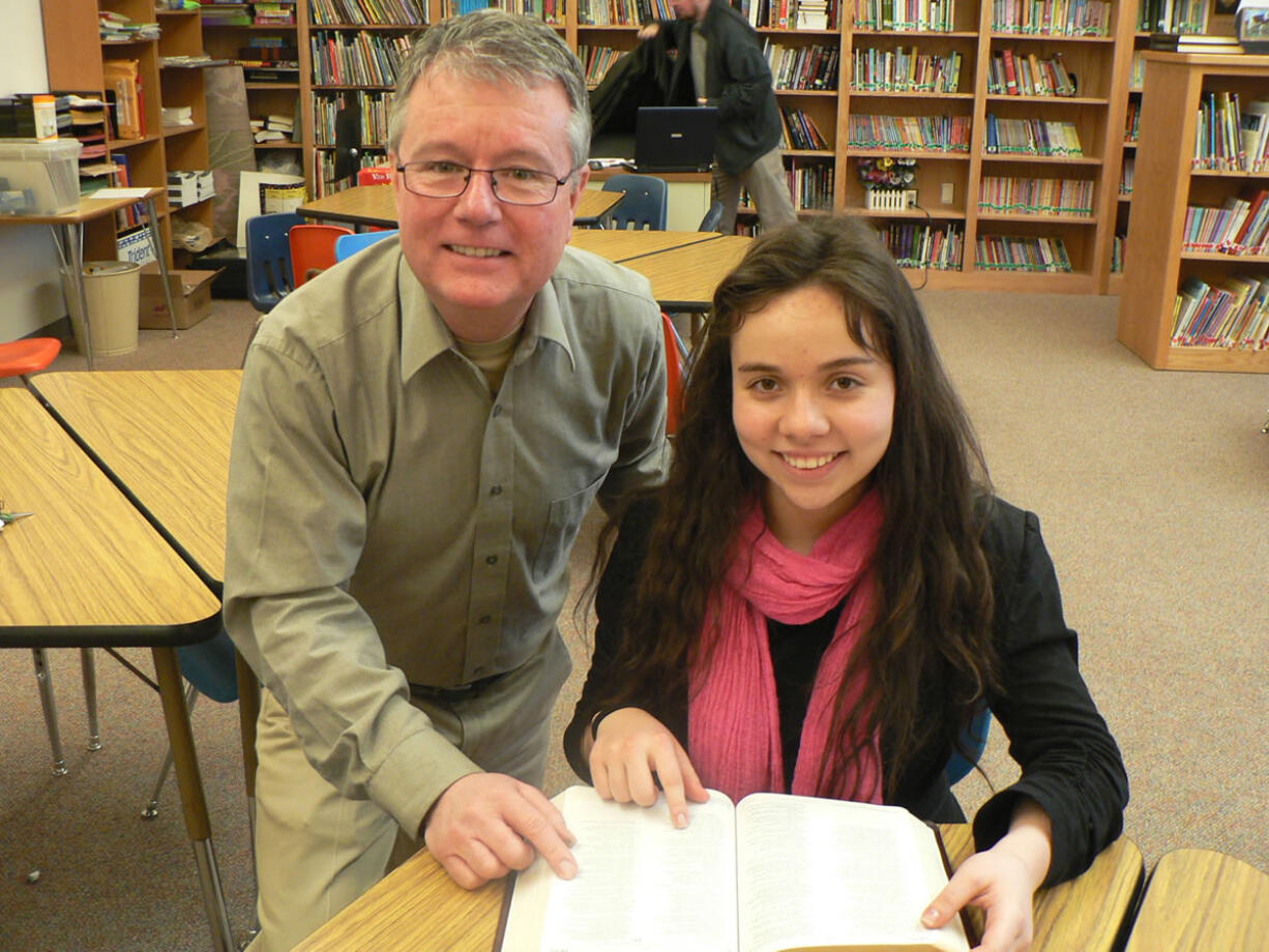 Battle Ground: Firm Foundation Christian School Administrator Scott Grove visits with freshman Jennifer Van Osdel.