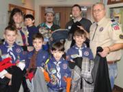 Bagley Downs: Members of Cub Scout Pack 320 drop off donated coats, which were collected Jan.