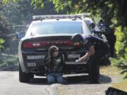 Vancouver officers detain a man, identified by police as Neal Stillwell, who allegedly shot his girlfriend's father with a BB gun Tuesday.