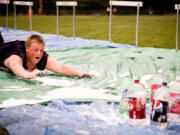 Ridgefield: Macauly Preuss, then a sophomore, demonstrates Olympic greatness in the Human Bowling event.