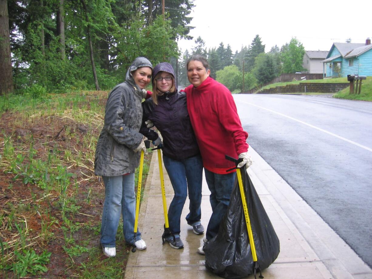 Northeast Hazel Dell: Super scoopers Joyce Sickemberge, from left, Crystal Whitlock and Annette Garcia collect litter at Luke Jensen Sports Park on June 23.