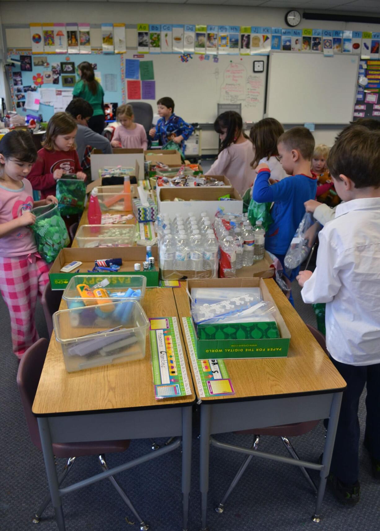 Ridgefield: Students at Union Ridge Elementary School assemble bags of necessities on the last day of school before winter break.