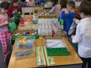 Ridgefield: Students at Union Ridge Elementary School assemble bags of necessities on the last day of school before winter break.