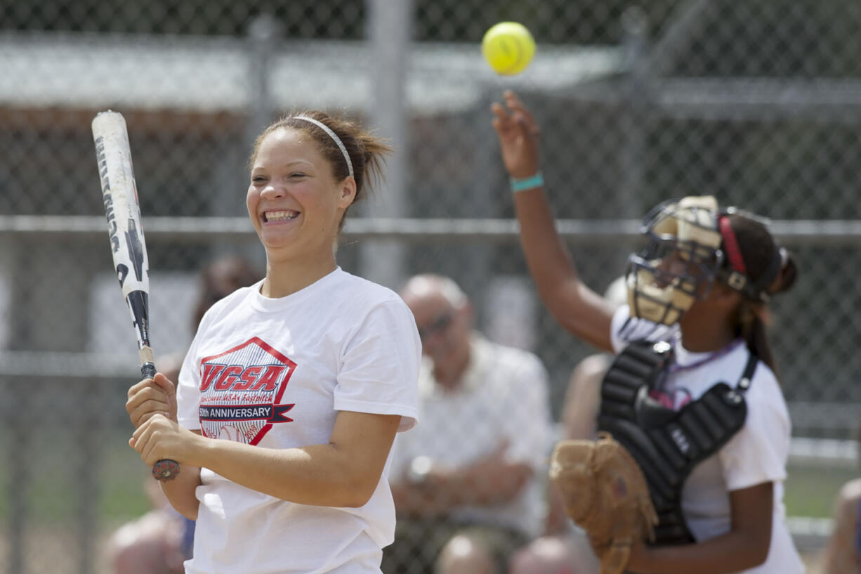 Maddie Anthony prepares to bat during VGSA's 50th Anniversary alumni softball game, Saturday, August 17, 2013.