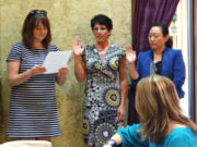 Shumway: YWCA Clark County Board of Directors President Megan Vaughn, from left, appoints Sherri Falkner and Pam Loh Velijacic to the 17-member board on June 26.