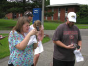 Central Park: Teachers Elyse Azorr of Portland, left, and Jason McNiece of Mesilla, N.M., right, learn about GPS and GIS surveying technology during the Teaching With Spatial Technology workshops June 24-28 at Clark College.