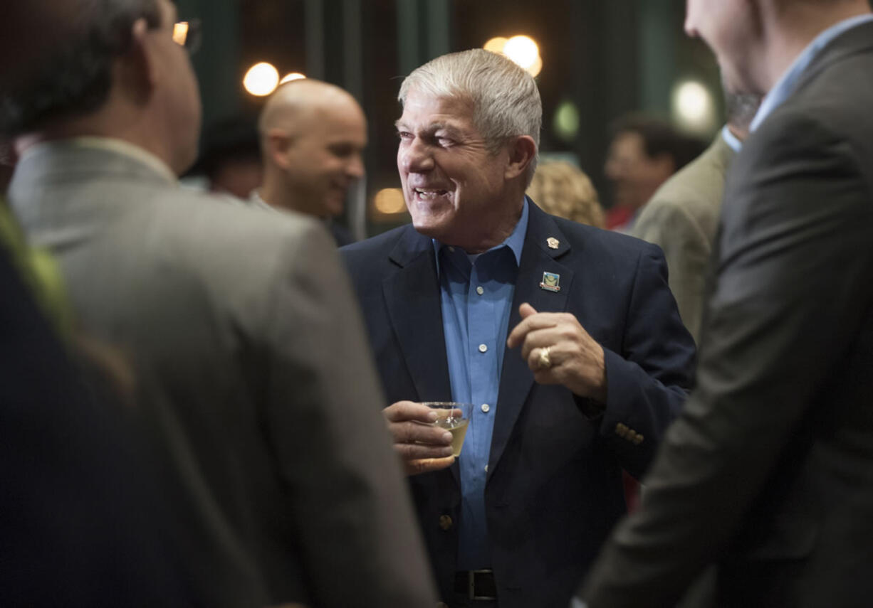 Vancouver City Councilor Larry Smith mingles at his retirement party Dec. 3 at Vancouver City Hall.