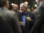 Vancouver City Councilor Larry Smith mingles at his retirement party Dec. 3 at Vancouver City Hall.