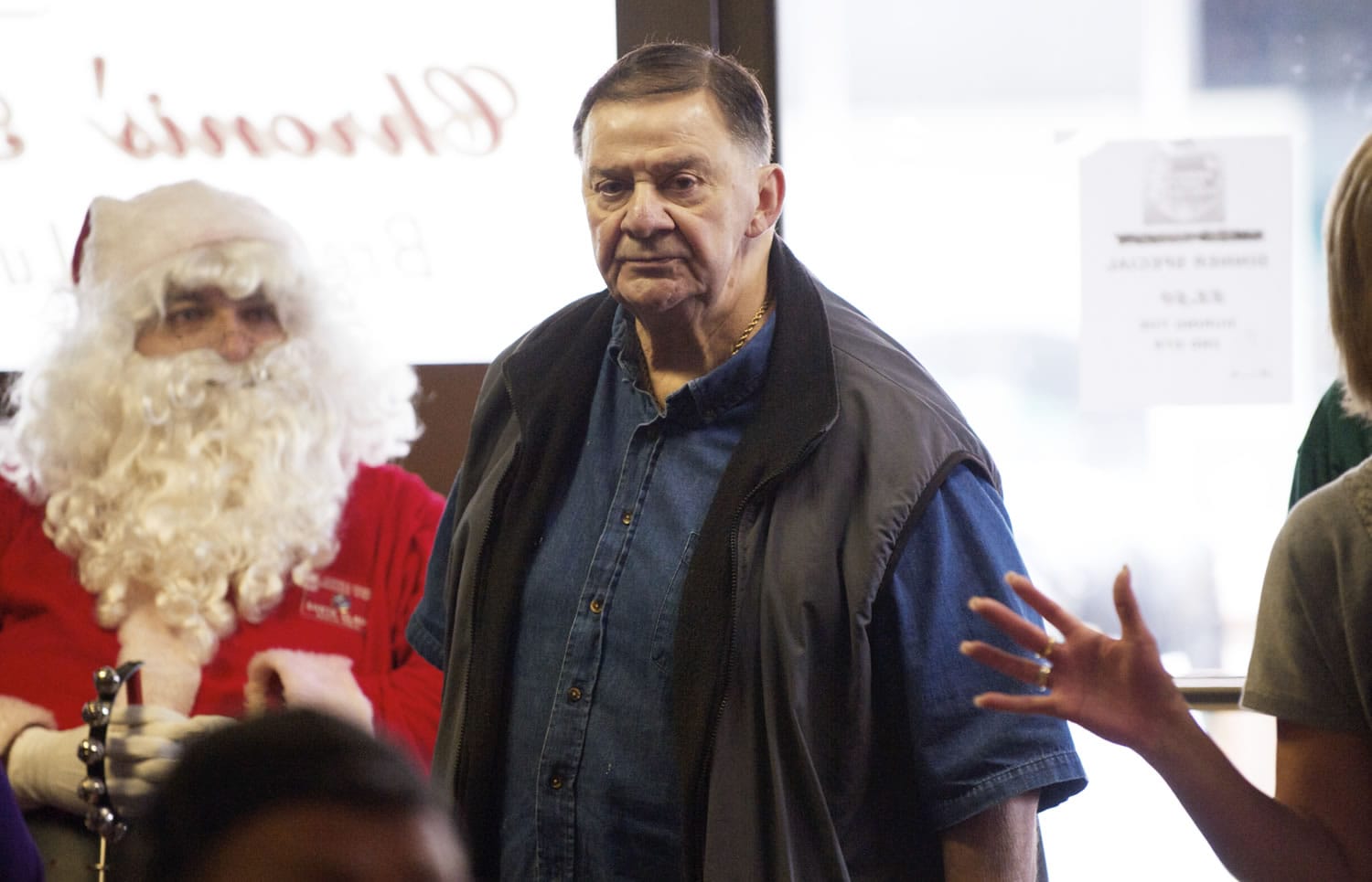 Chuck Chronis surveys the crowd at Chronis' Restaurant's free Thanksgiving meal Thursday.