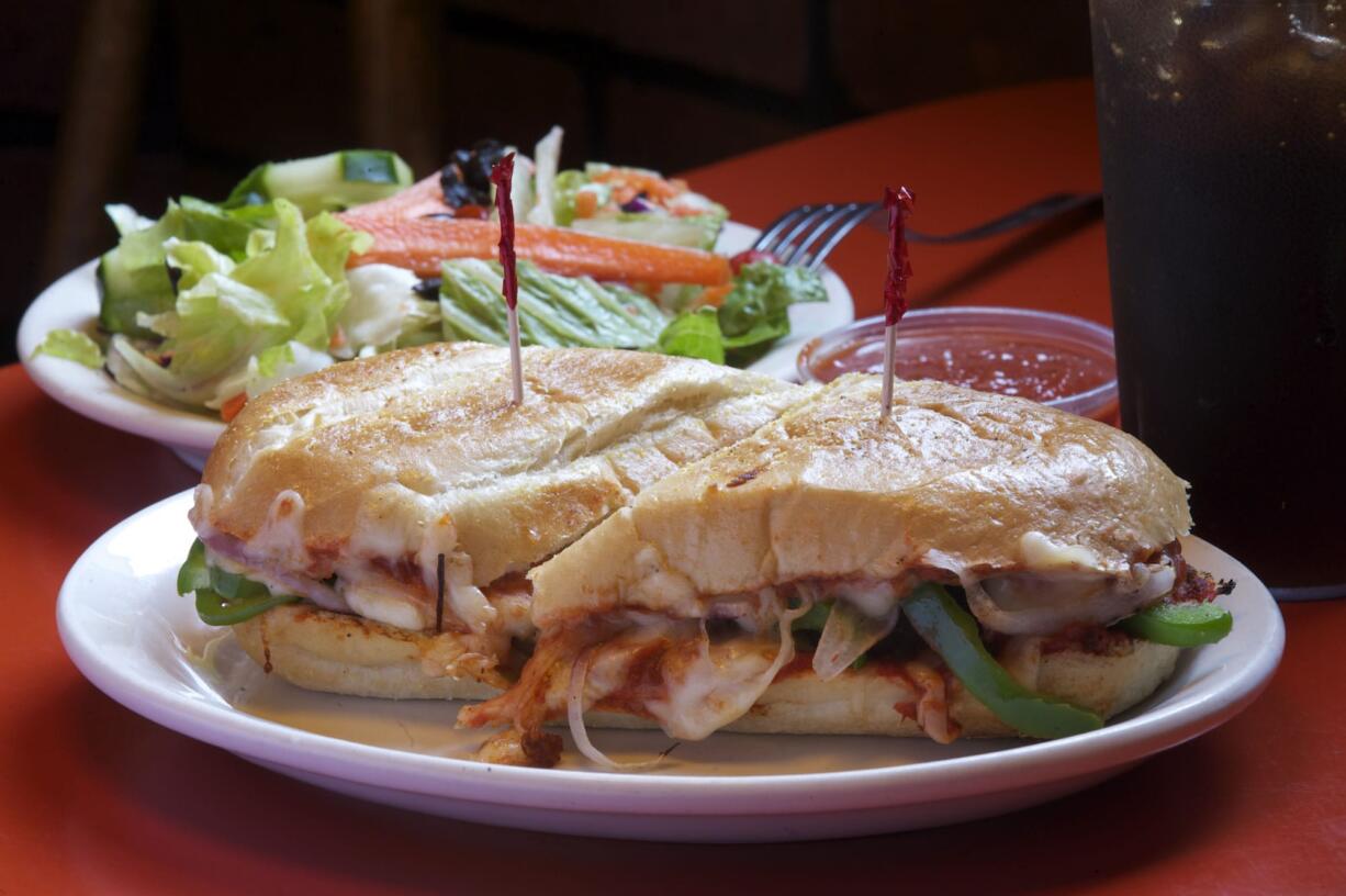 Hot Italian sandwich with meatballs and green dinner salad at Smokey's Pizza in Hazel Dell.