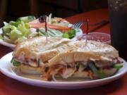 Hot Italian sandwich with meatballs and green dinner salad at Smokey's Pizza in Hazel Dell.