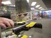 Gun control advocates seeking to expand the use of background checks filed a ballot initiative in Washington.