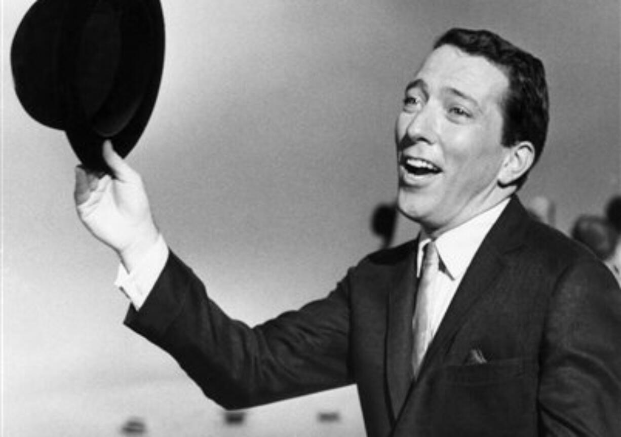 Singer Andy Williams performs a song on a television show in May 1961. The Emmy-winning TV host and &quot;Moon River&quot; crooner died Tuesday night at his home in Branson, Mo., following a year-long battle with bladder cancer.