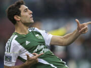 The Portland Timbers' Diego Valeri celebrates after scoring to tie the game 1-1 against the New York Red Bulls in the first half of their season opener at Jeld-Wen Field on Sunday.