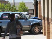 Steven Lane/The Columbian
An SUV hit a building housing a Chase Bank and a Subway restaurant at 13620 N.E. 84th St. on Friday.