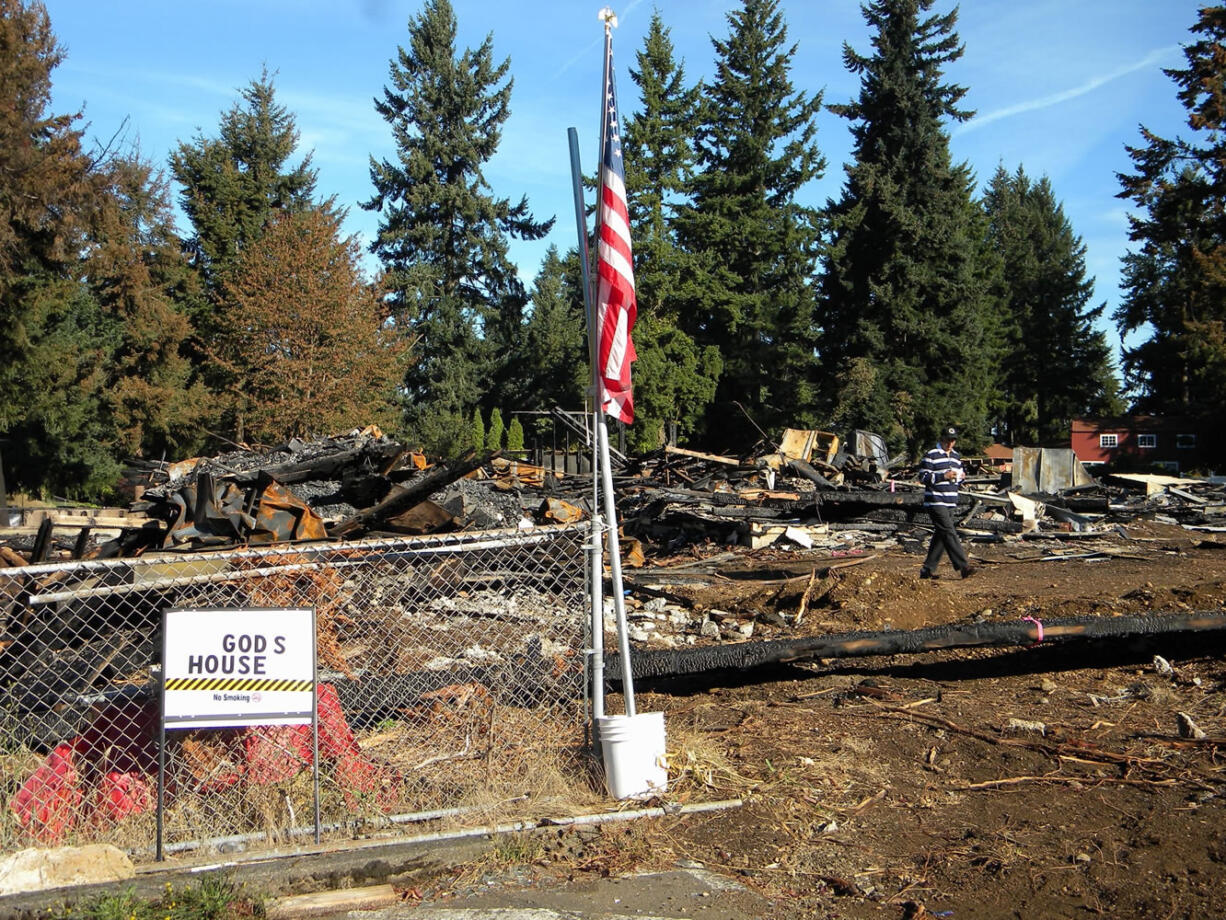 Sarabeet Teja, president of the Guru Ramdass Sikh Gurdwara, inspects the wreckage of what would have been his community's new temple in East Vancouver.