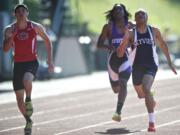 Skyview senior Kevin Washington, right, finishes first in the 4A boys 200 meters.