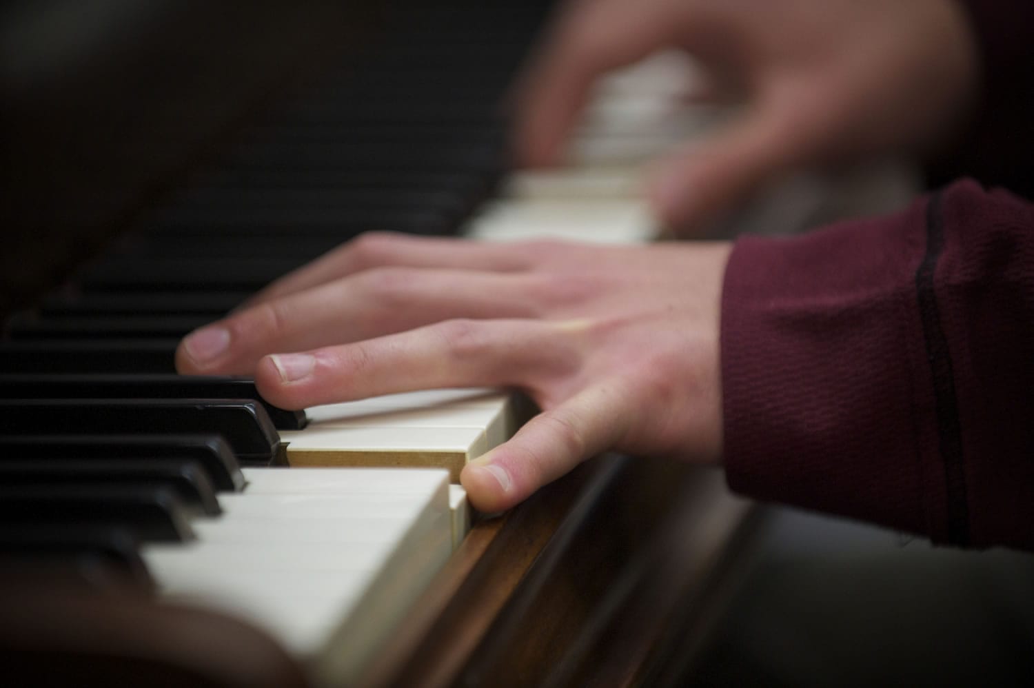 Mac Potts plays piano at the School of Piano and Technology for the Blind.