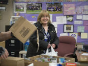 Share hunger-response Assistant Director Becky Parker lends a hand Friday at the first mobile, fresh-food pantry at Gaiser Middle School. The mobile pantry is a joint venture between Share and Vancouver Public Schools&#039; Family-Community Resource Centers.