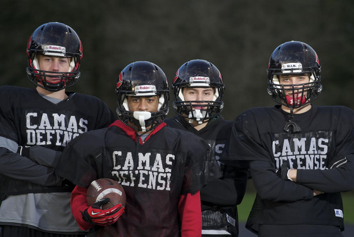 Camas defensive backs (from left) Jack Beall, Jorden Payne Zach Eagle and Connor Maloney will be tested in Saturday's 4A state semifinal game against Skyline.